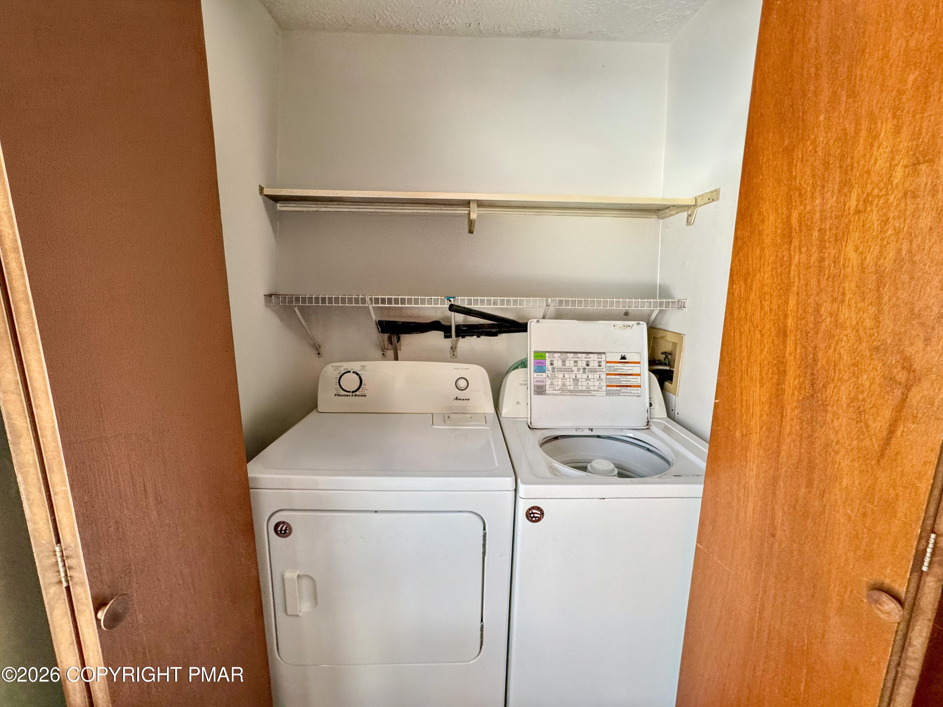 217 Bindale Road Tamiment, PA 18371 - Photo 9 of 27 a utility room with dryer and washer