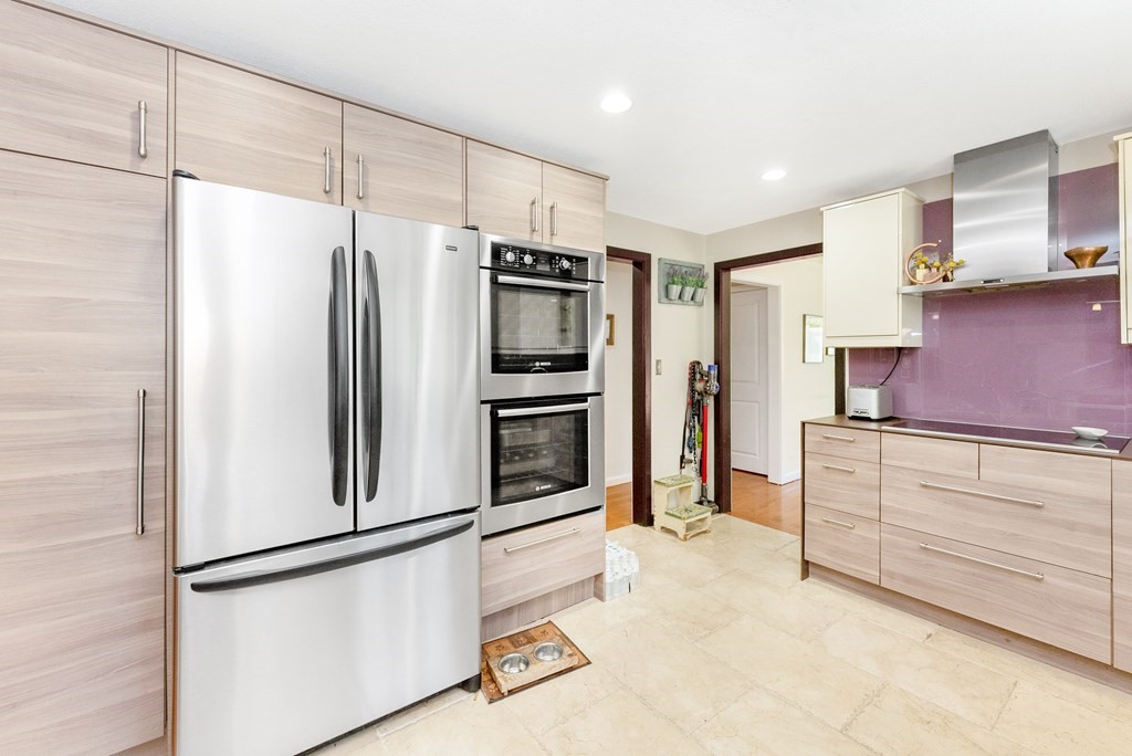37 River Ridge Wellesley, MA 02481 - Photo 11 of 33 a kitchen with stainless steel appliances a refrigerator and cabinets