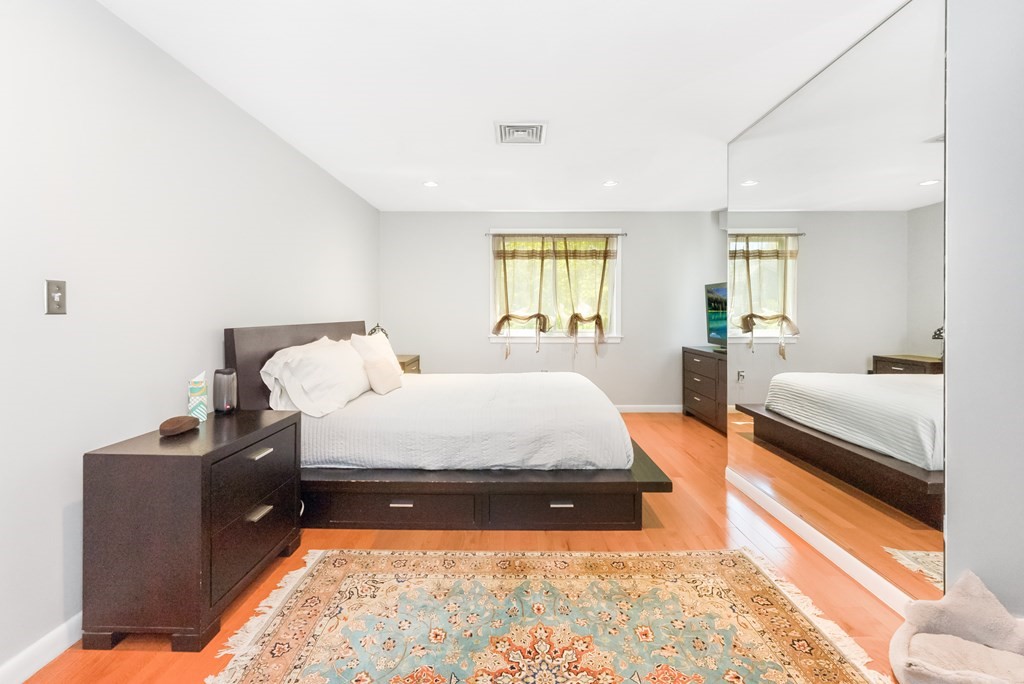 37 River Ridge Wellesley, MA 02481 - Photo 18 of 33 a bed room with a bed and a couch