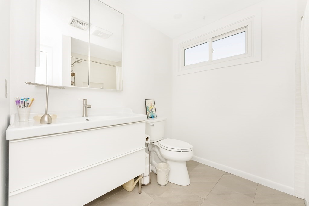 37 River Ridge Wellesley, MA 02481 - Photo 19 of 33 a bathroom with a sink toilet and mirror