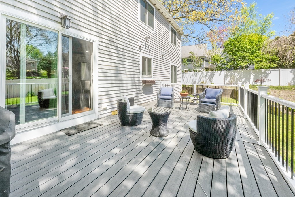 37 River Ridge Wellesley, MA 02481 - Photo 26 of 33 a view of a deck with table and chairs and wooden floor