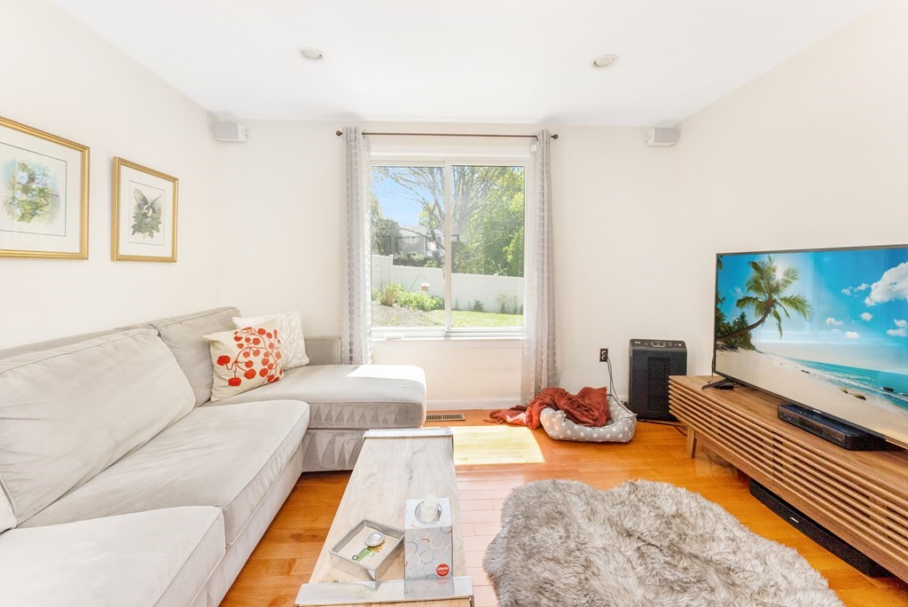 37 River Ridge Wellesley, MA 02481 - Photo 7 of 33 a living room with furniture and a flat screen tv