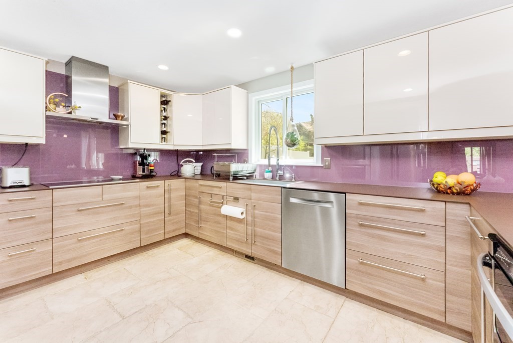 37 River Ridge Wellesley, MA 02481 - Photo 9 of 33 a kitchen with granite countertop white cabinets and white appliances