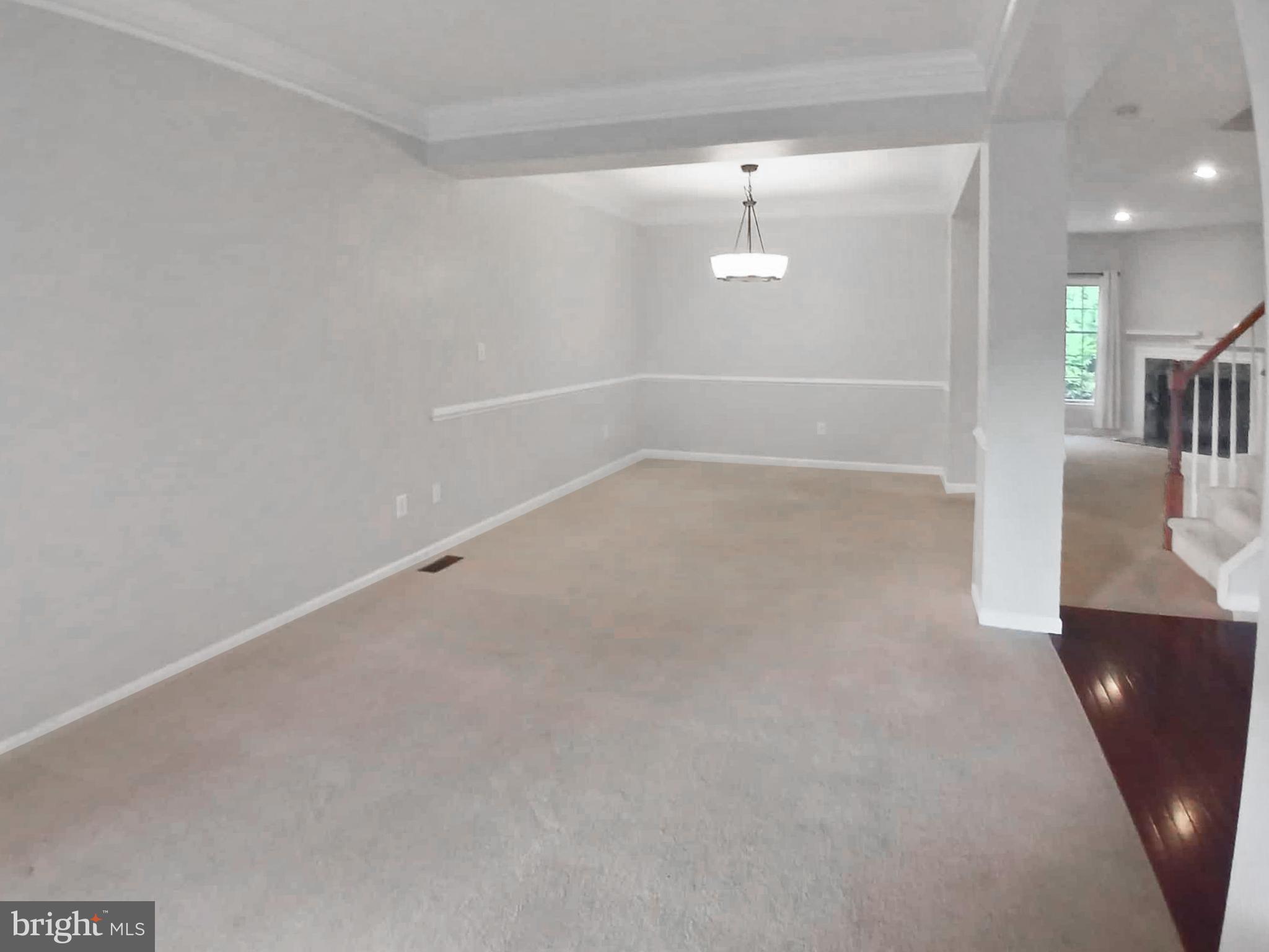 9 Wedgewood Court Princeton, NJ 08540 - Photo 5 of 14 an empty room with wooden floor and windows
