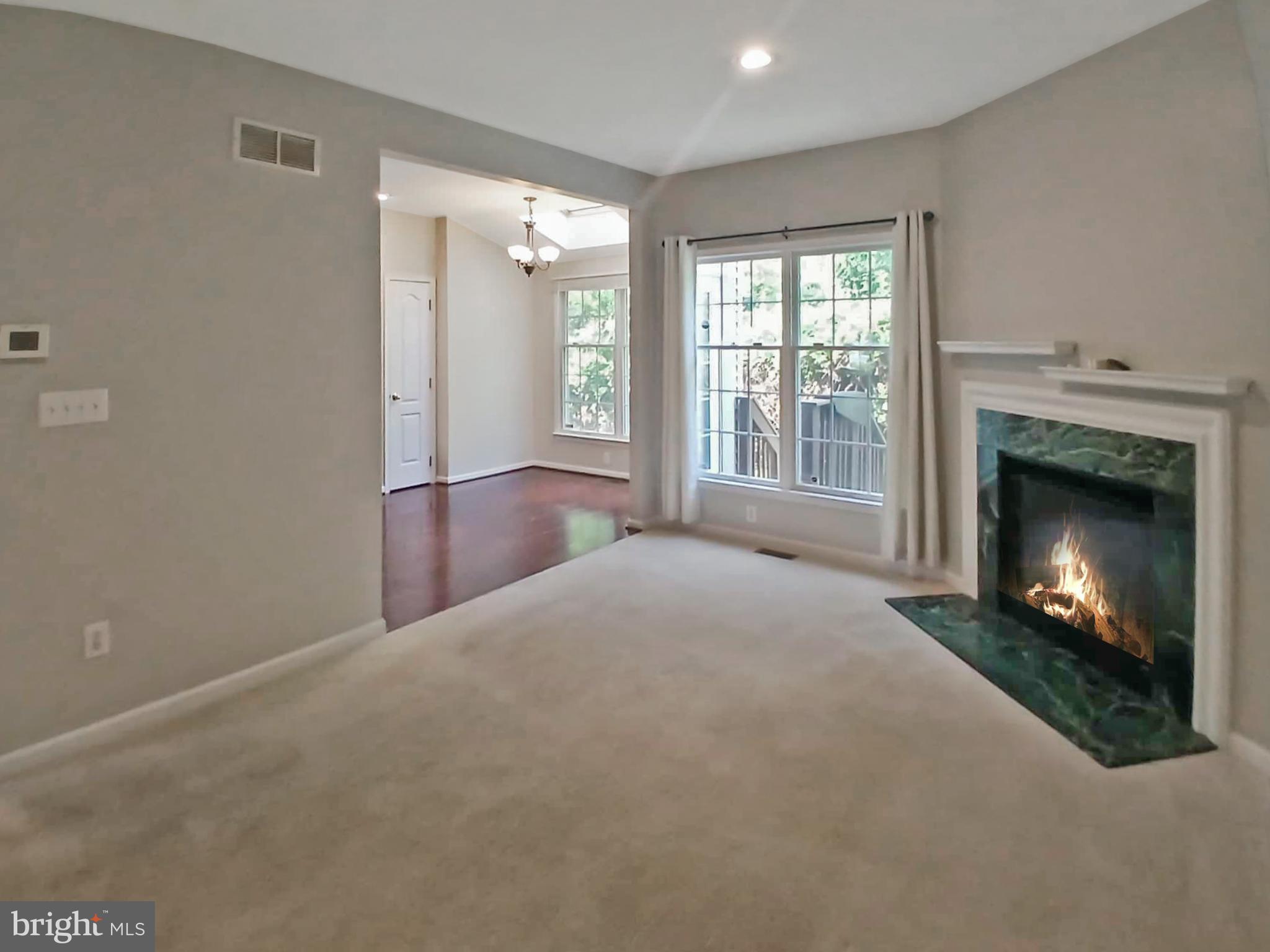 9 Wedgewood Court Princeton, NJ 08540 - Photo 7 of 14 a view of a livingroom with a fireplace and window
