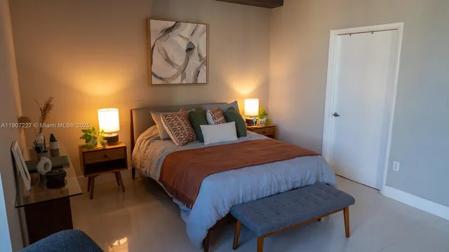 a bedroom with a bed and wall painting