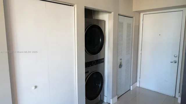 a close view of a utility room with washer and dryer