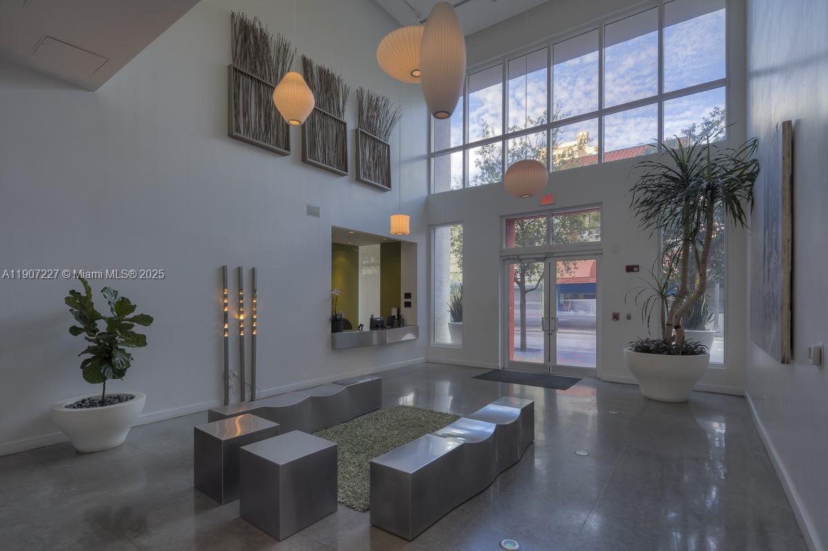 133 Northeast 2nd Avenue, Unit 3308 Miami, FL 33132 - Photo 3 of 14 a living room with furniture and a potted plant