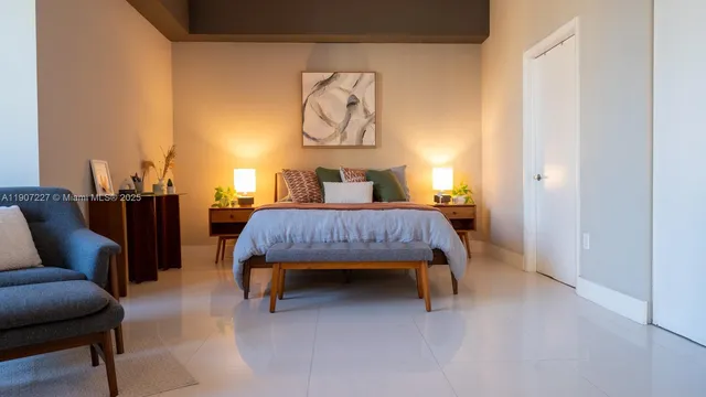 a bed room with a bed and furniture