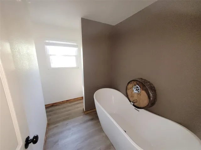 a bathroom with a toilet and a vanity