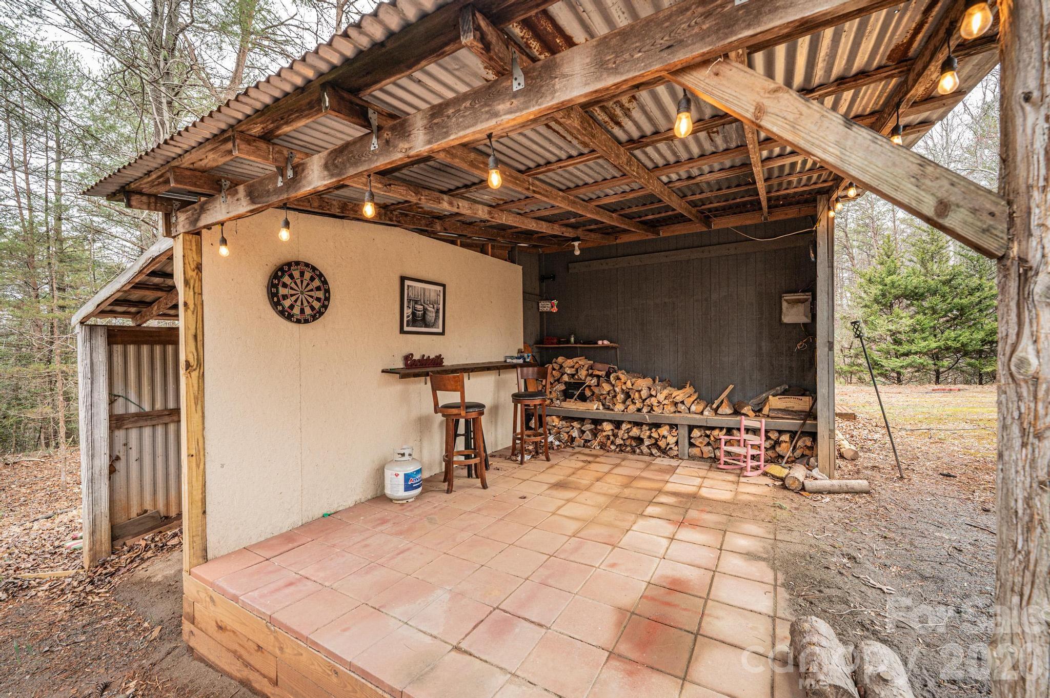 173 Croom Hollow Road Nebo, NC 28761 - Photo 19 of 43 a view of a backyard with a patio