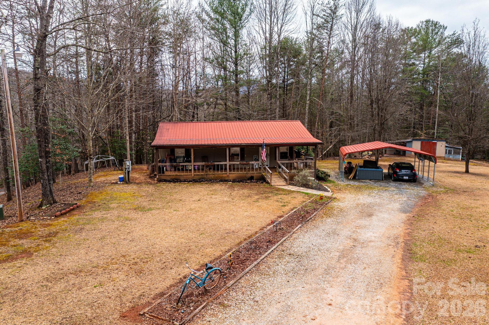 173 Croom Hollow Road Nebo, NC 28761 - Photo 2 of 43 a swimming pool with outdoor seating and yard