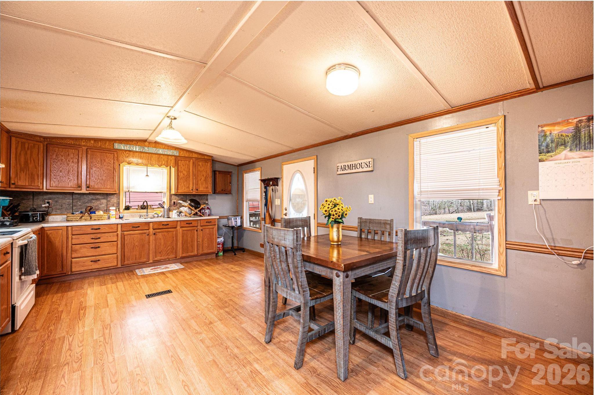 173 Croom Hollow Road Nebo, NC 28761 - Photo 23 of 43 a large kitchen with a table and chairs