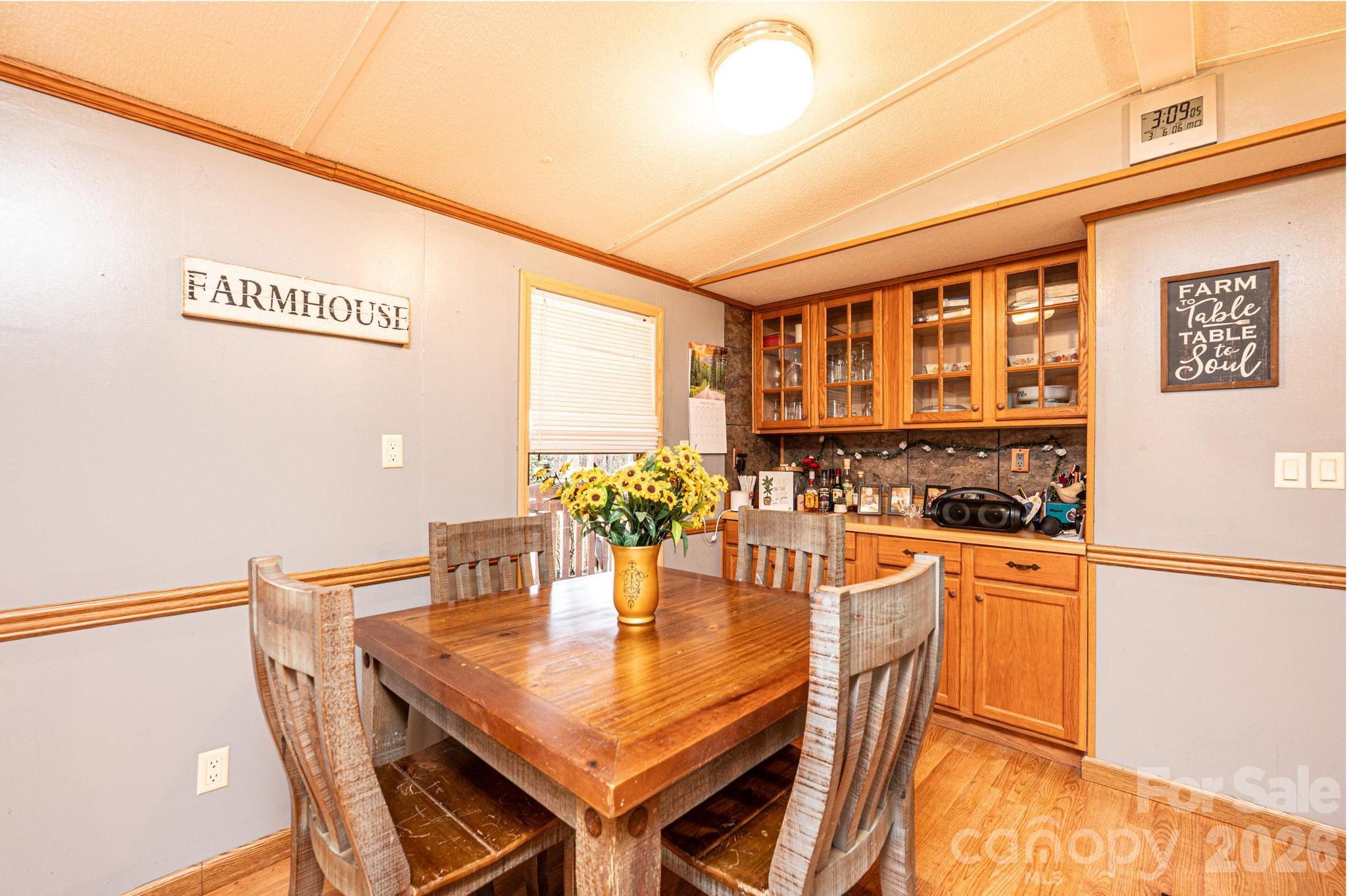 173 Croom Hollow Road Nebo, NC 28761 - Photo 24 of 43 a view of a dining table and chairs