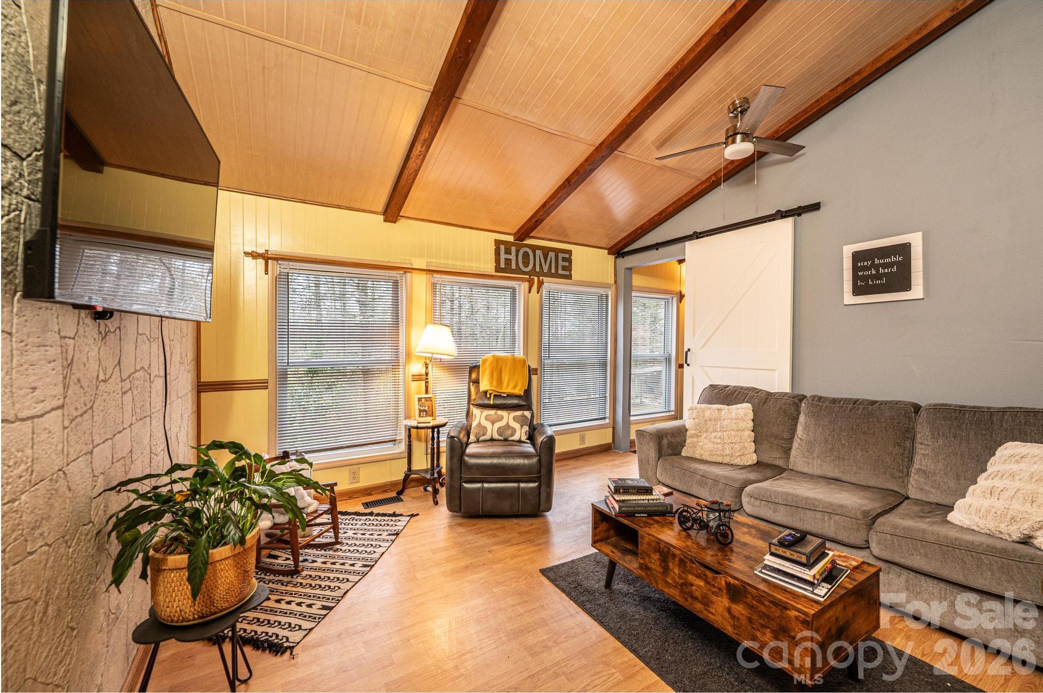 173 Croom Hollow Road Nebo, NC 28761 - Photo 26 of 43 a living room with furniture a couch and a table