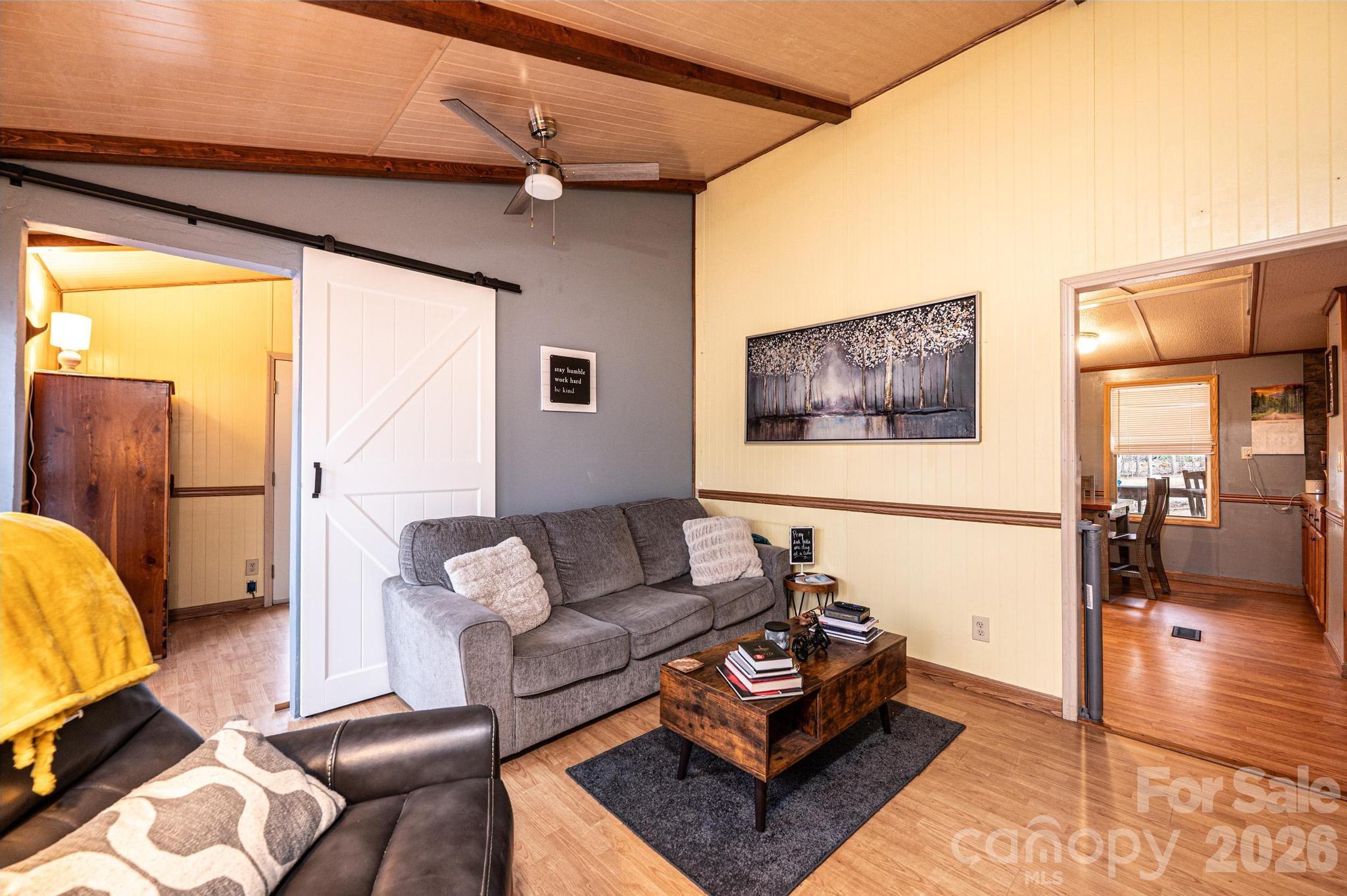 173 Croom Hollow Road Nebo, NC 28761 - Photo 27 of 43 a living room with furniture and a table