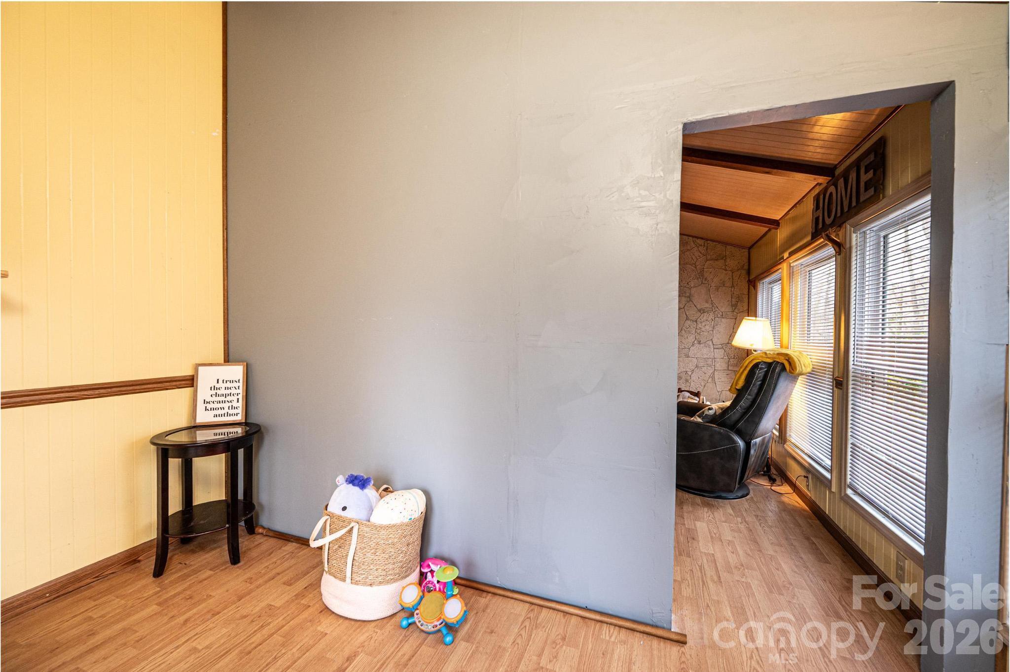 173 Croom Hollow Road Nebo, NC 28761 - Photo 32 of 43 a view of a hallway to a livingroom and a furniture