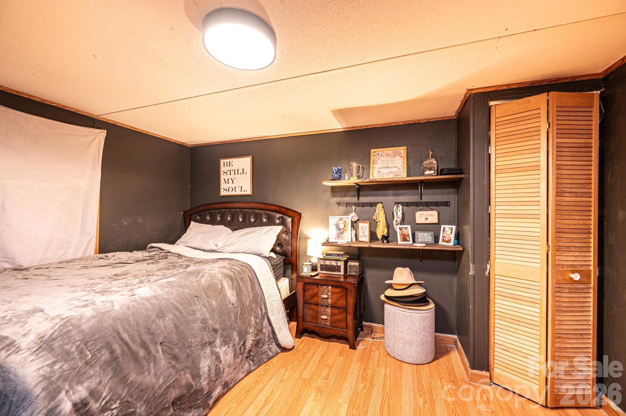 173 Croom Hollow Road Nebo, NC 28761 - Photo 38 of 43 a bedroom with a bed and window