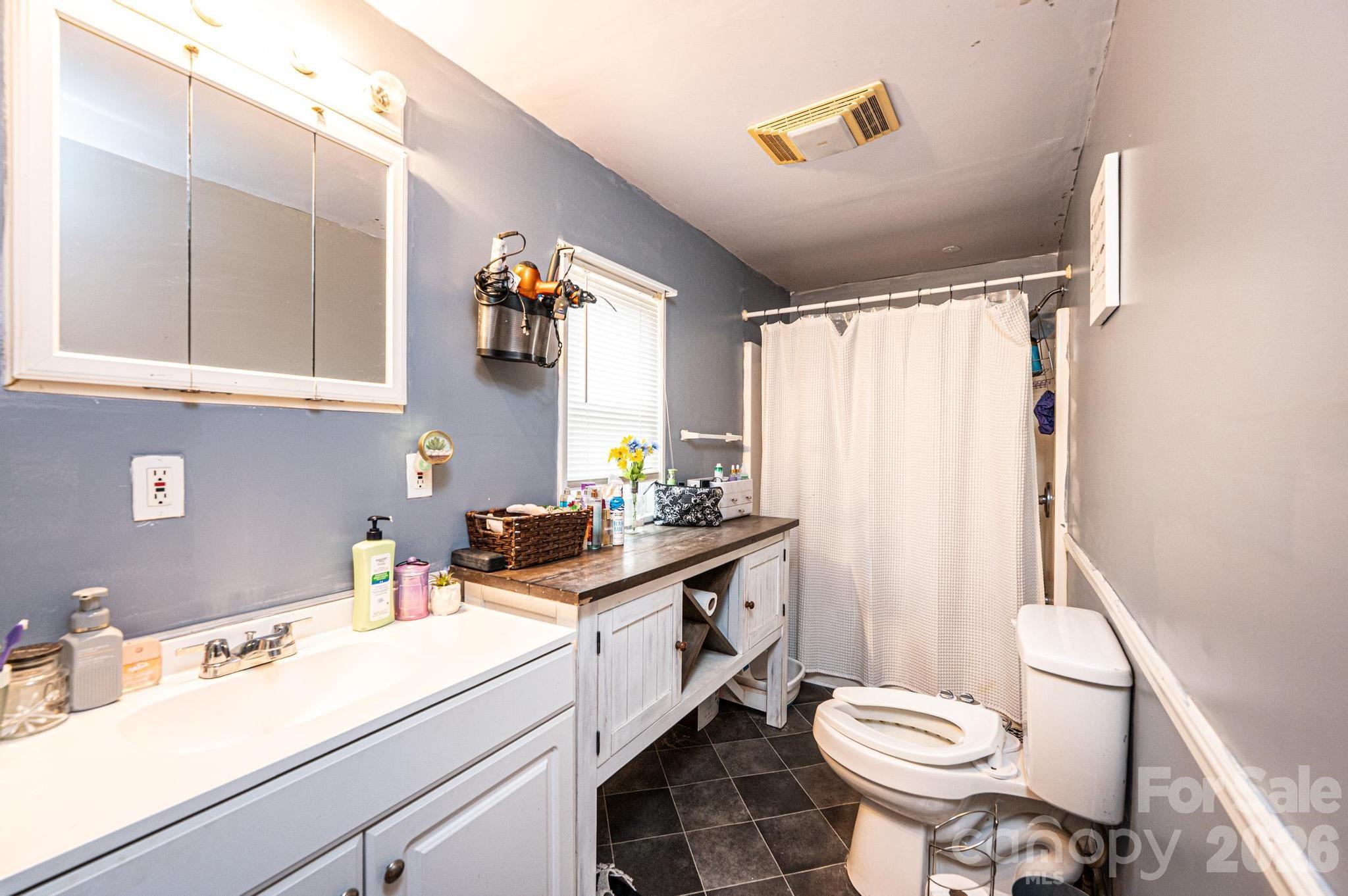 173 Croom Hollow Road Nebo, NC 28761 - Photo 41 of 43 a bathroom with a sink toilet and shower