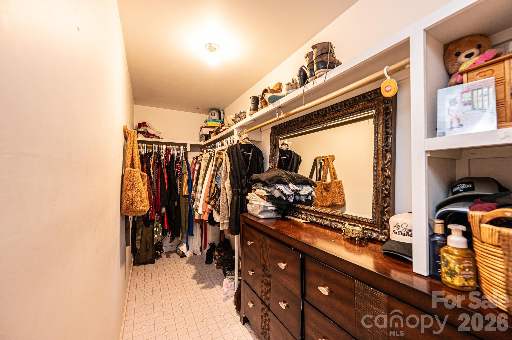 173 Croom Hollow Road Nebo, NC 28761 - Photo 42 of 43 a view of walk in closet with clothes and shoes