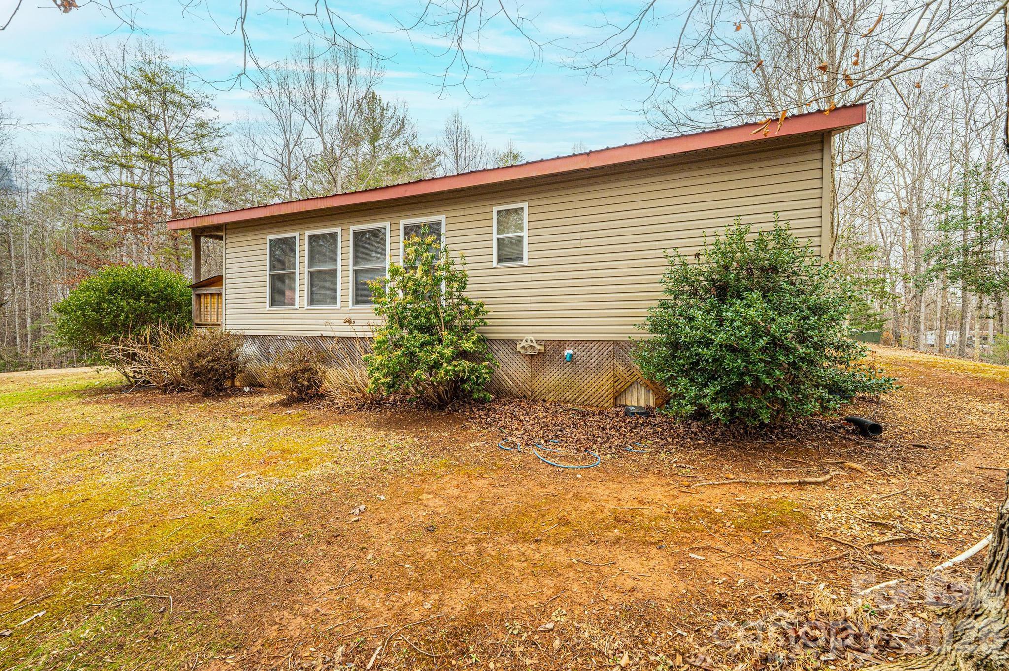 173 Croom Hollow Road Nebo, NC 28761 - Photo 6 of 43 a view of a house with backyard and garden