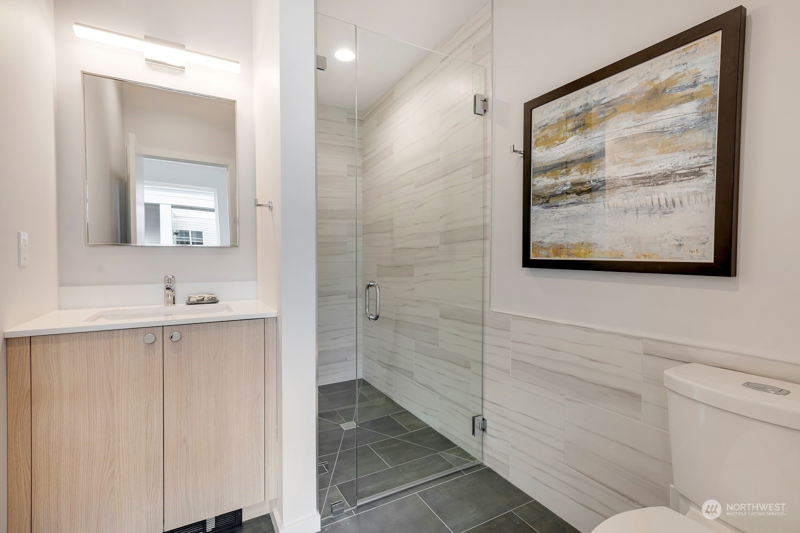 17342 D Bothell Way Northeast Bothell, WA 98011 - Photo 12 of 22 a bathroom with a sink mirror and a shower