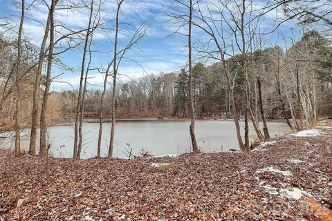 a view of a pathway of a house with a yard
