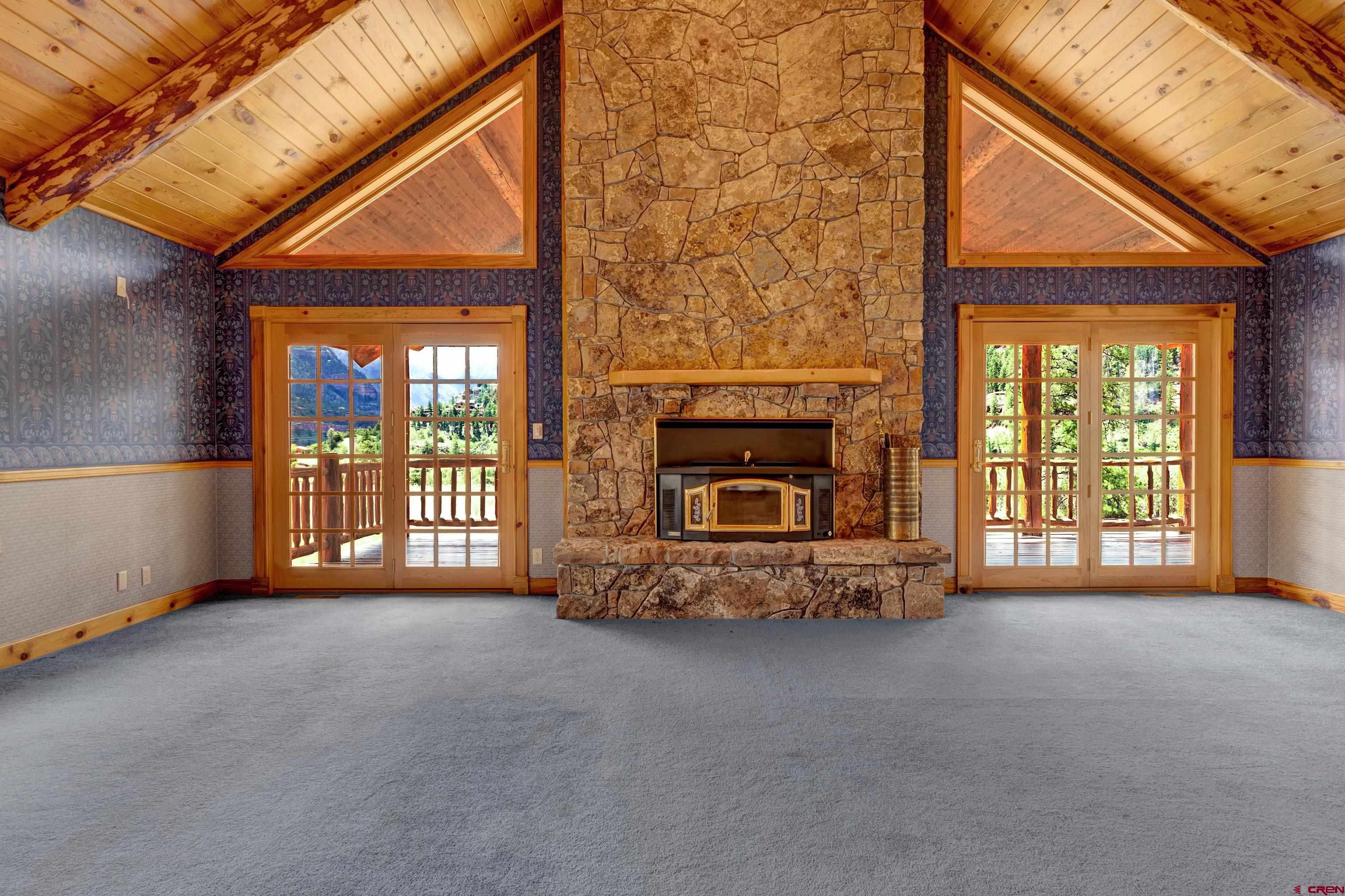 2692 County Road 17 Ridgway, CO 81432 - Photo 15 of 38 a view of an empty room with a fireplace