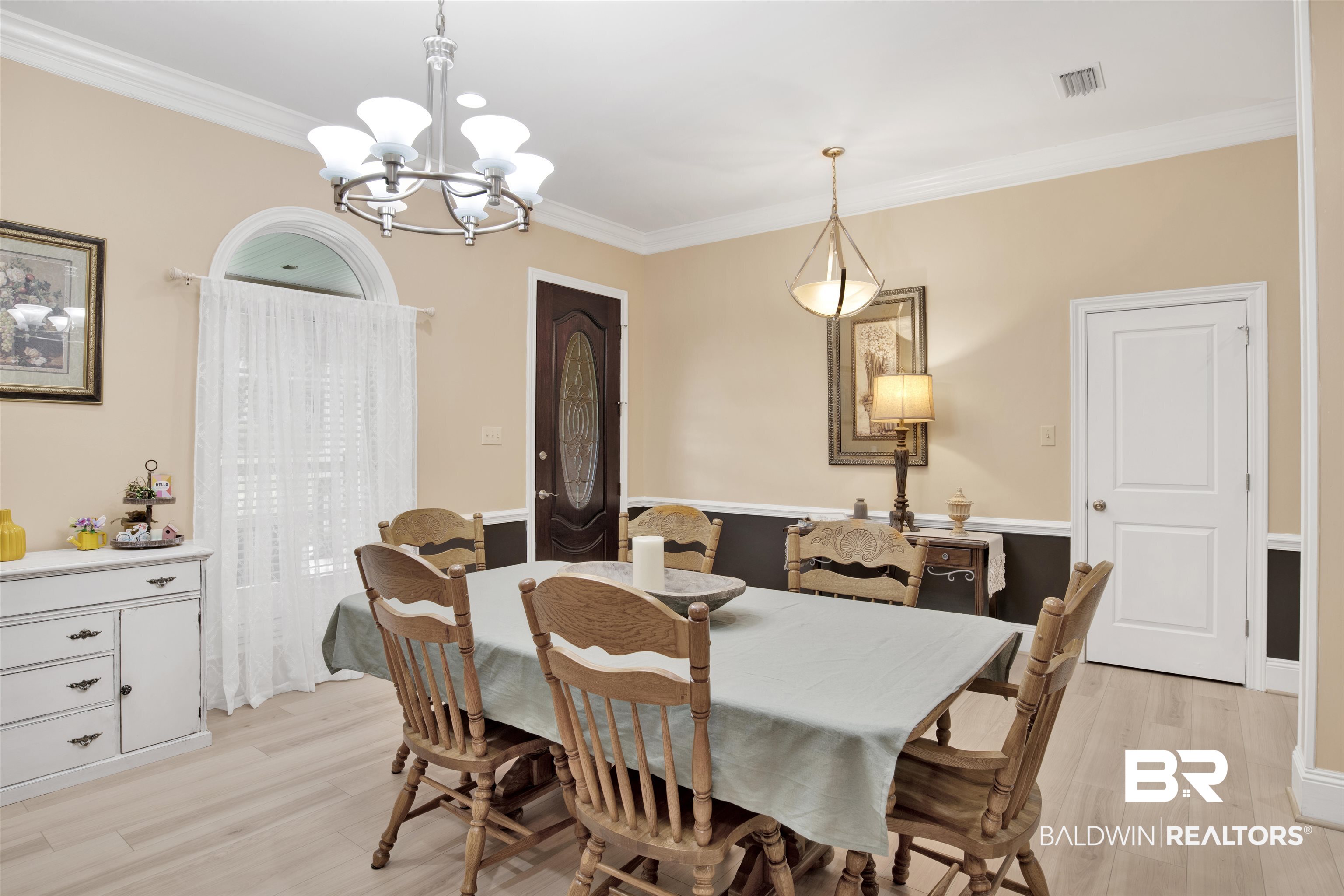 4340 Hamilton Oaks Lane Mobile, AL 36695 - Photo 5 of 51 Dining space with light hardwood / wood-style floors, crown molding, and an inviting chandelier