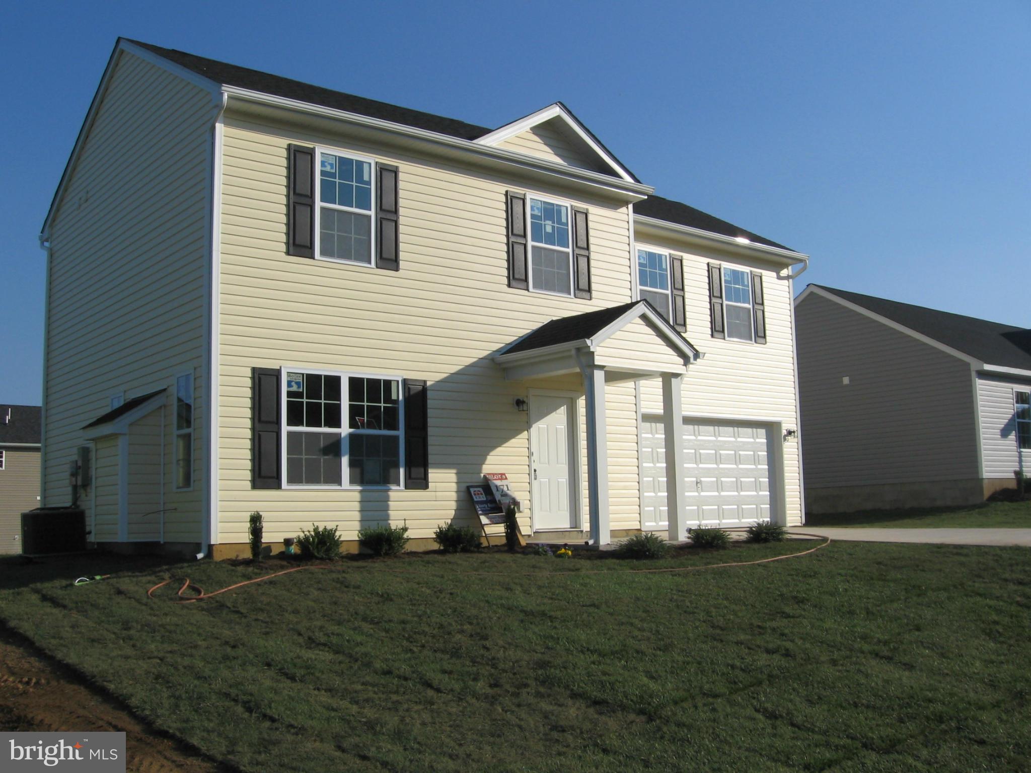 58 Gibson Road Inwood, WV 25428 - Photo 1 of 17 front view of a house with a yard