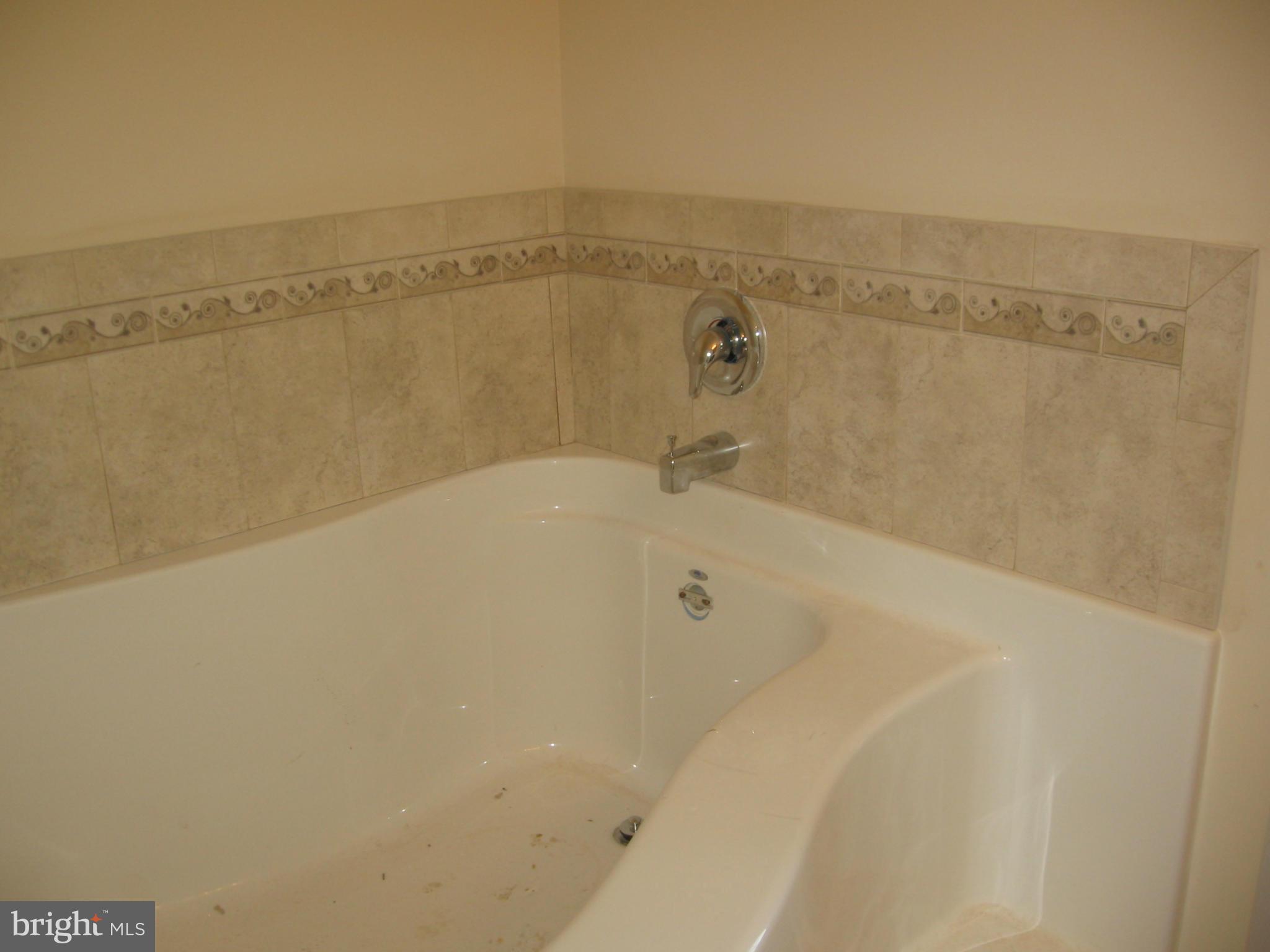 58 Gibson Road Inwood, WV 25428 - Photo 15 of 17 a view of a bath tub sitting in a bathroom