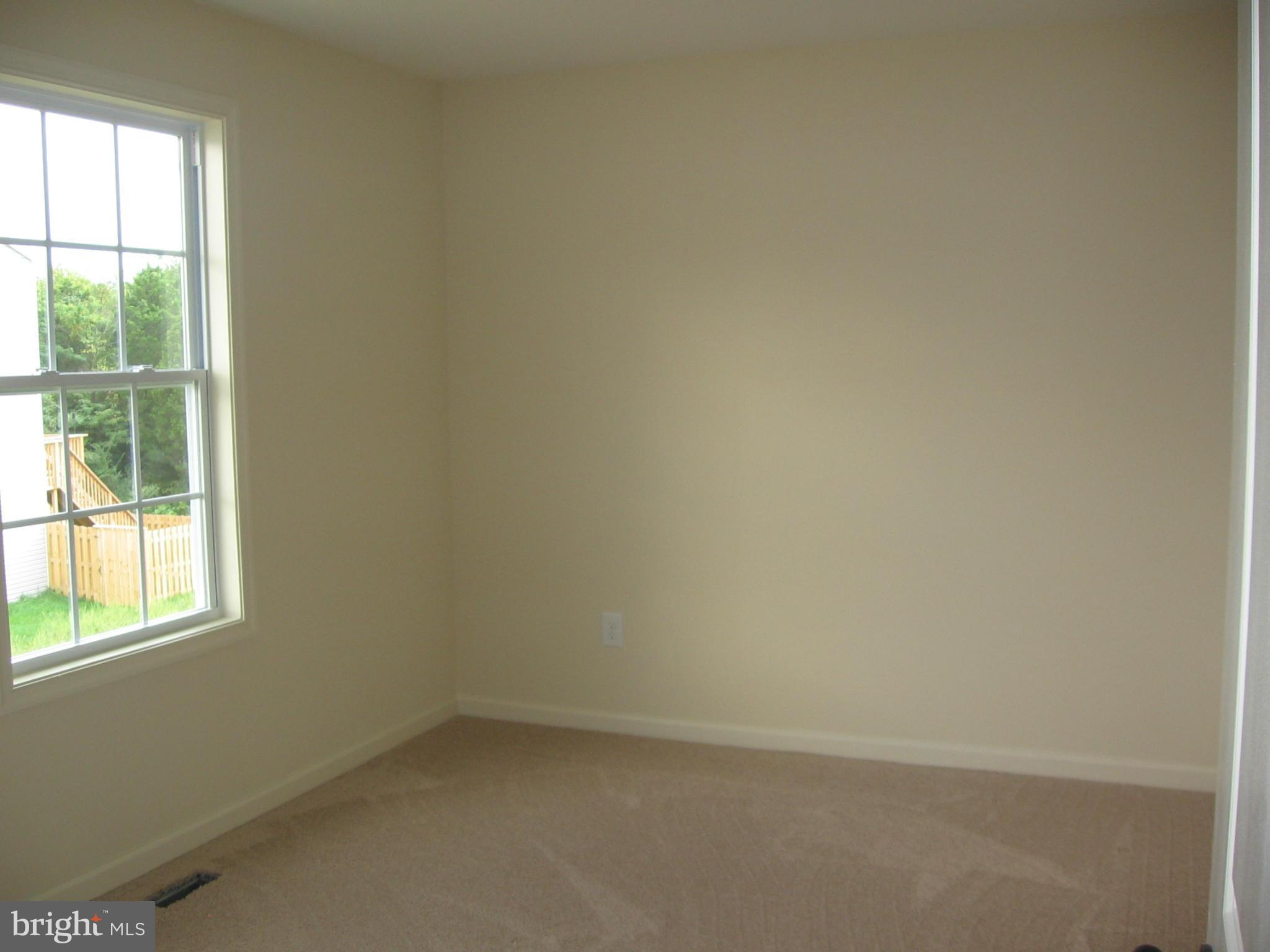 58 Gibson Road Inwood, WV 25428 - Photo 17 of 17 an empty room with a window
