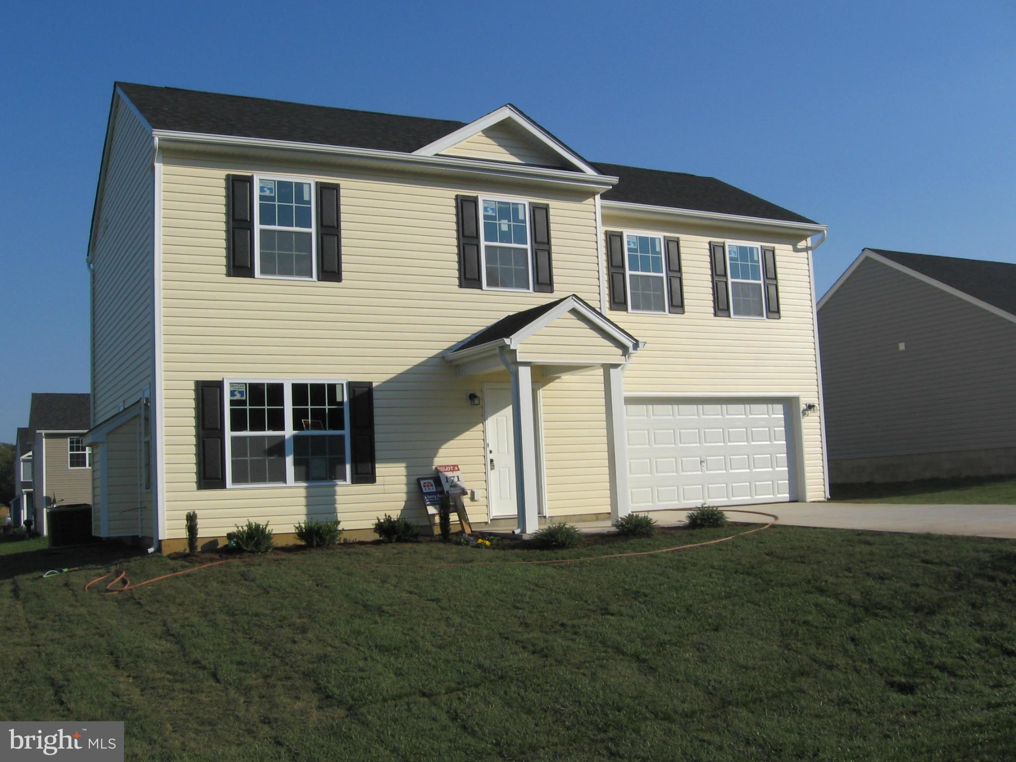 58 Gibson Road Inwood, WV 25428 - Photo 3 of 17 a view of a house with backyard