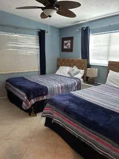 a bedroom with bed and window