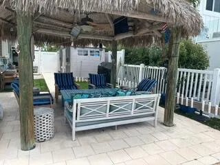 a view of porch with a table and chairs