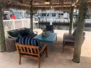 a view of a chairs and tables in the patio