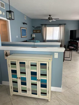 a living room with a piano and a flat screen tv