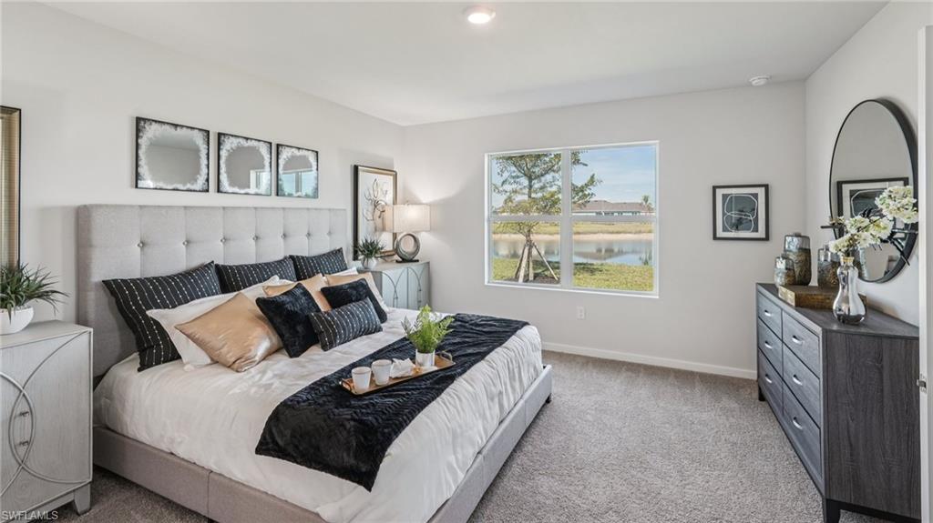 17584 Shade Tree Loop Punta Gorda, FL 33982 - Photo 15 of 35 Light gray wall paint and matching carpet flooring