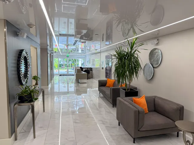 a kitchen with a stove a sink and cabinets