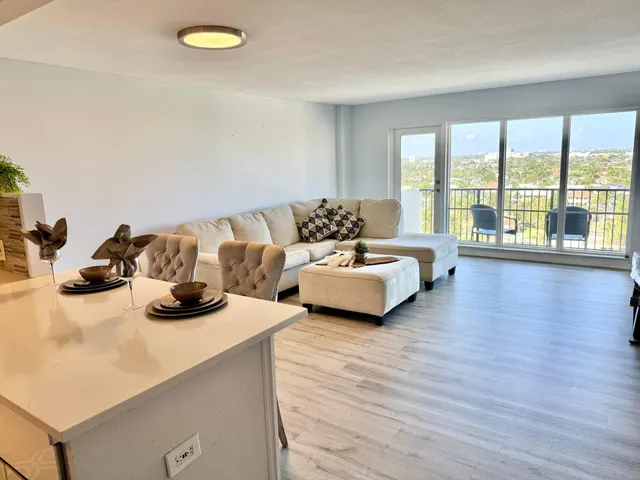 a bedroom with a bed dresser and a window