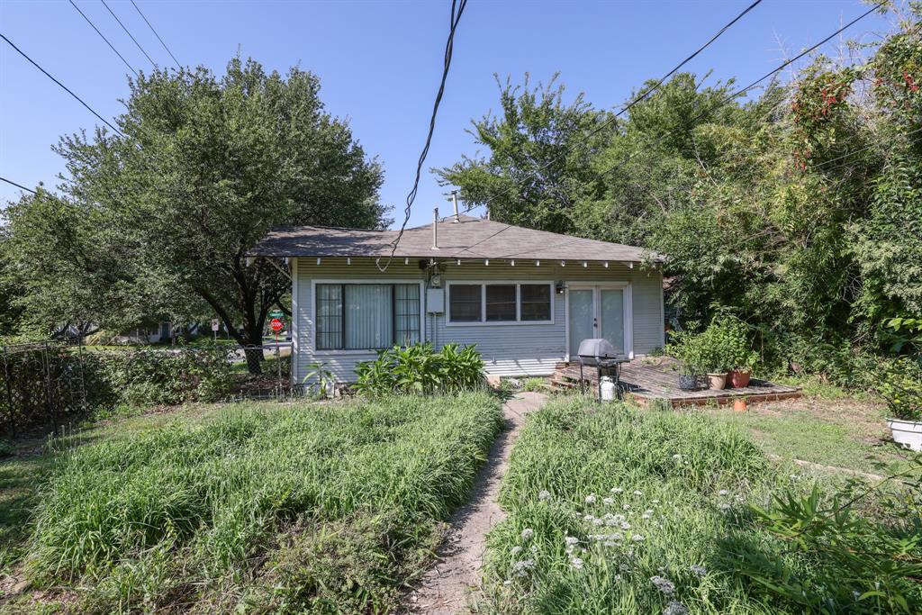 700 North Beacon Street Dallas, TX 75214 - Photo 12 of 13 a front view of a house with a garden