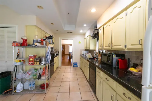 a kitchen with stainless steel appliances a sink and cabinets