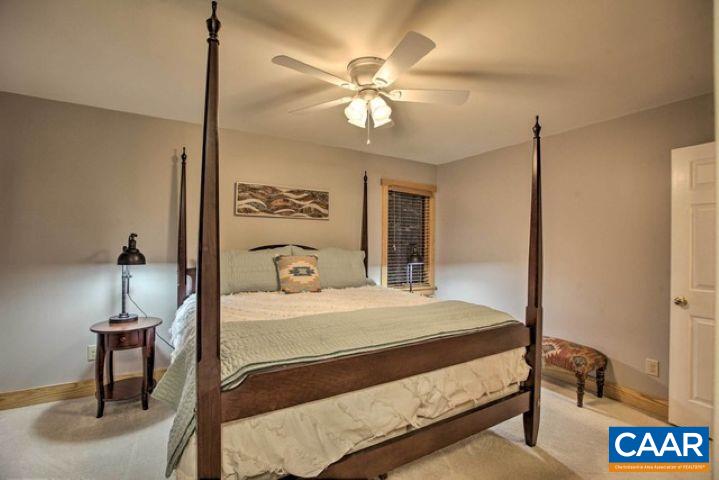 280 Fawn Ridge Drive Roseland, VA 22967 - Photo 19 of 23 a bedroom with a bed and a table