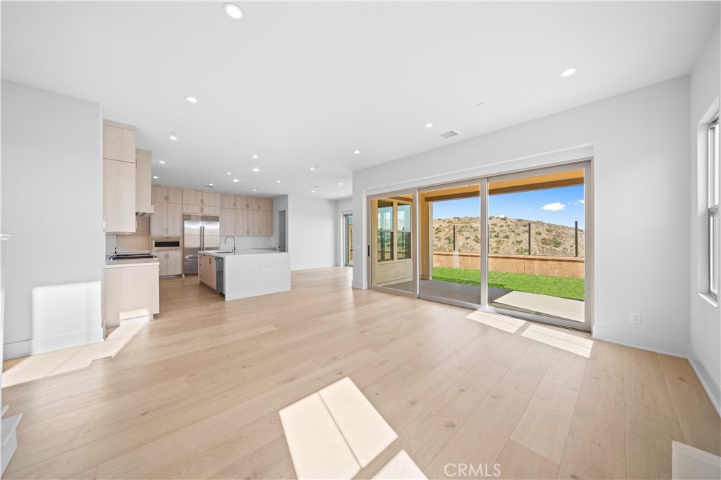100 Mossvine Irvine, CA 92618 - Photo 13 of 44 a view of an empty room with a stove top oven and kitchen view