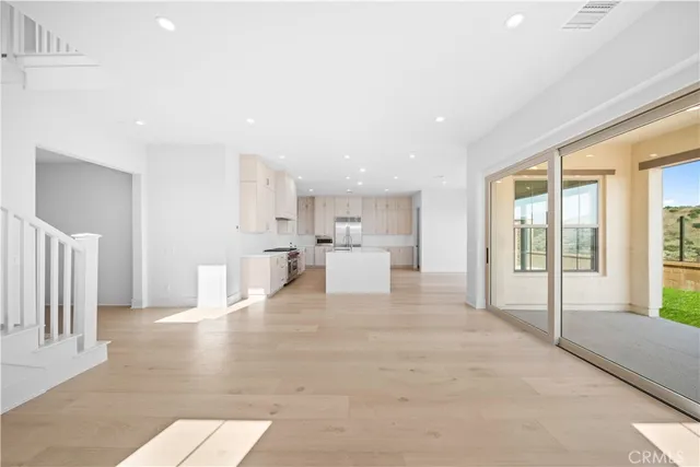 a view of an empty room with a sliding door