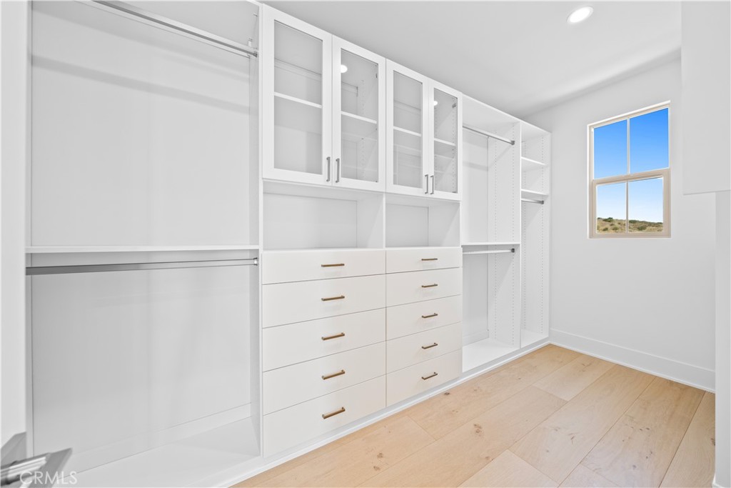 100 Mossvine Irvine, CA 92618 - Photo 26 of 44 a view of an empty walk in closet