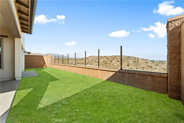 a view of a garden with a terrace