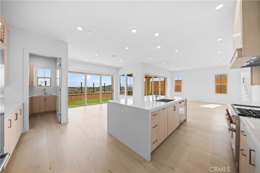 100 Mossvine Irvine, CA 92618 - Photo 10 of 44 a large white kitchen with a large window