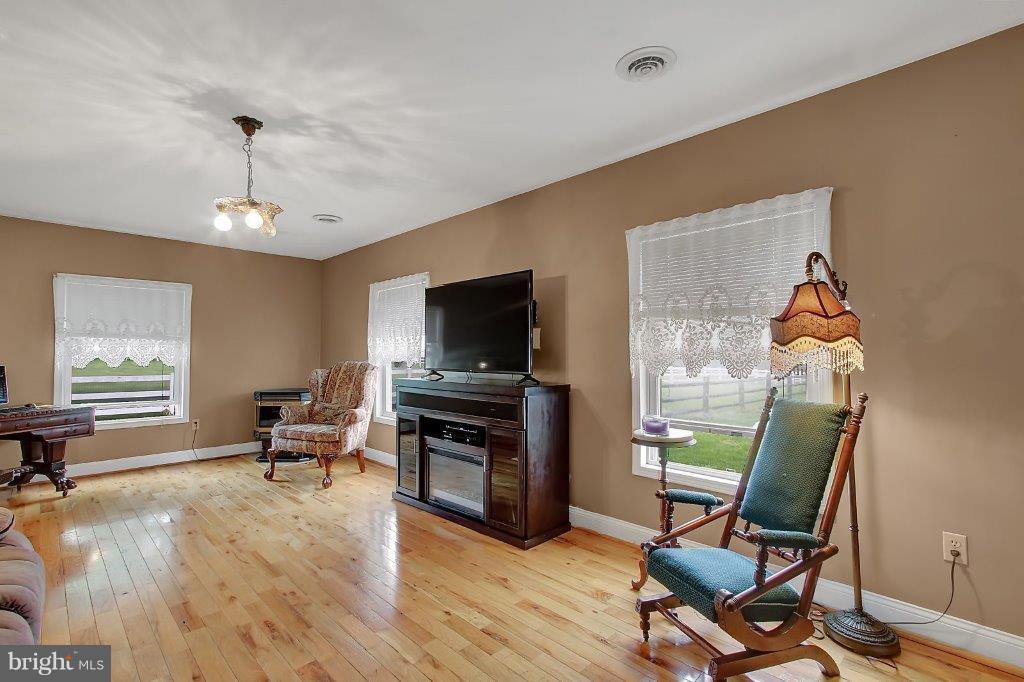 249 Walnut Garden Road Rising Sun, MD 21911 - Photo 11 of 28 Family Room-Gas Pellet Stove and Wood Flooring