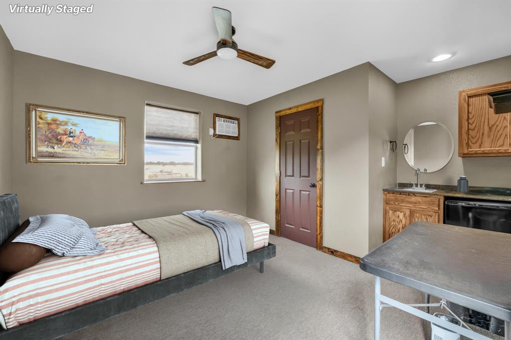 613 Bone Road Valley Mills, TX 76689 - Photo 34 of 40 a bedroom with a bed and wooden floor
